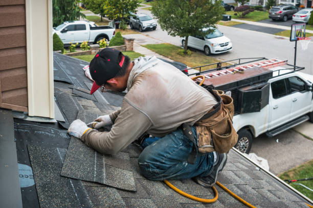 Professional Roofing technician working in Iowa City, IA